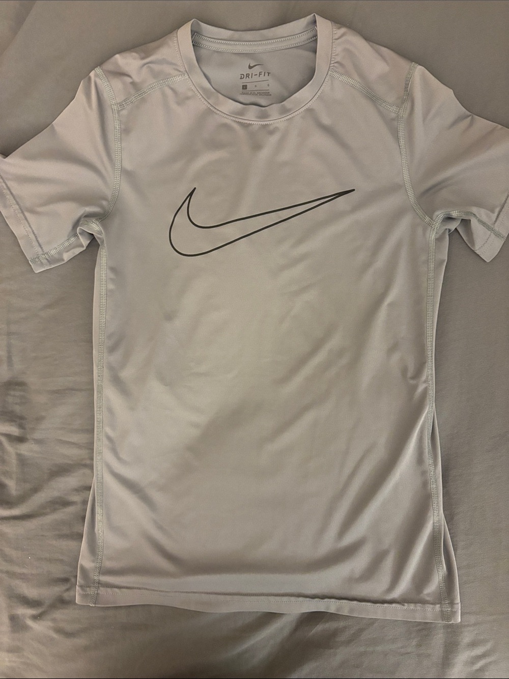 Nike Dri-FIT Short Sleeve Tee in Light Gray with Black Swoosh